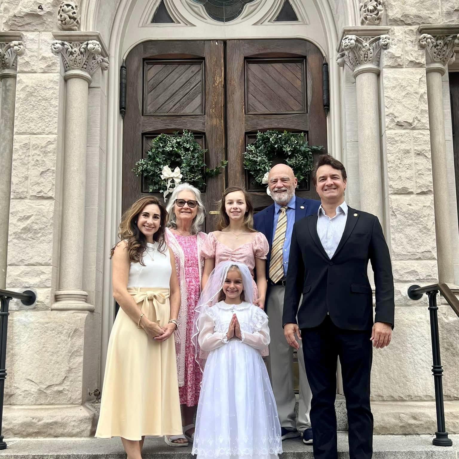 Bruce Porter Jr. with his family at a Catholic church